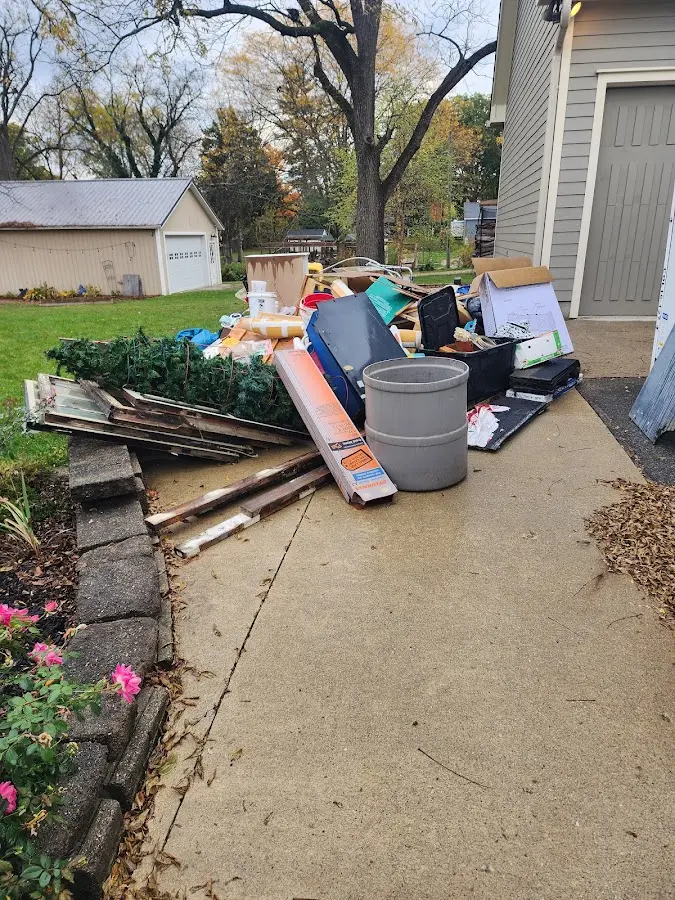 Dumpster being loaded with debris for Demolition Dumpster Rental in Pittsfield